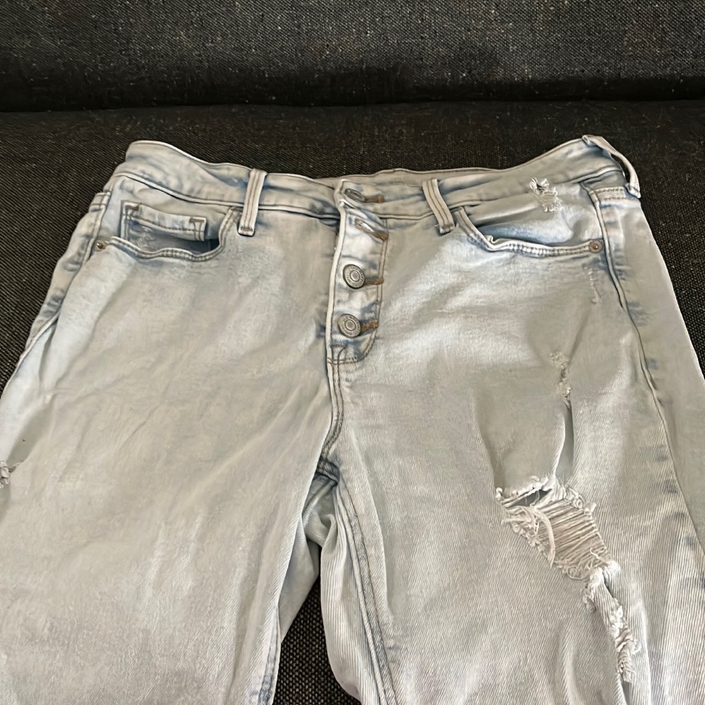 Barely worn light blue ripped jeans.